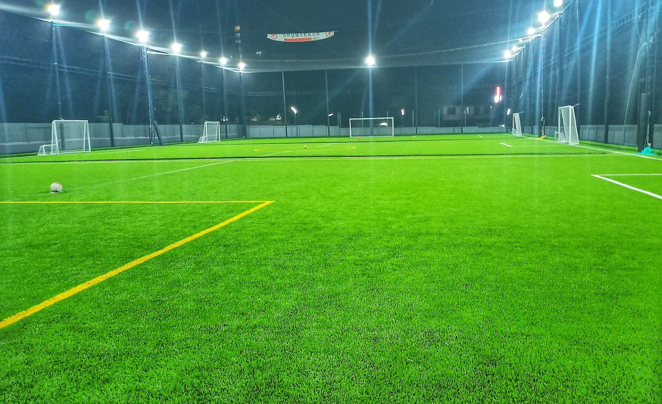 Floodlit football turf at night